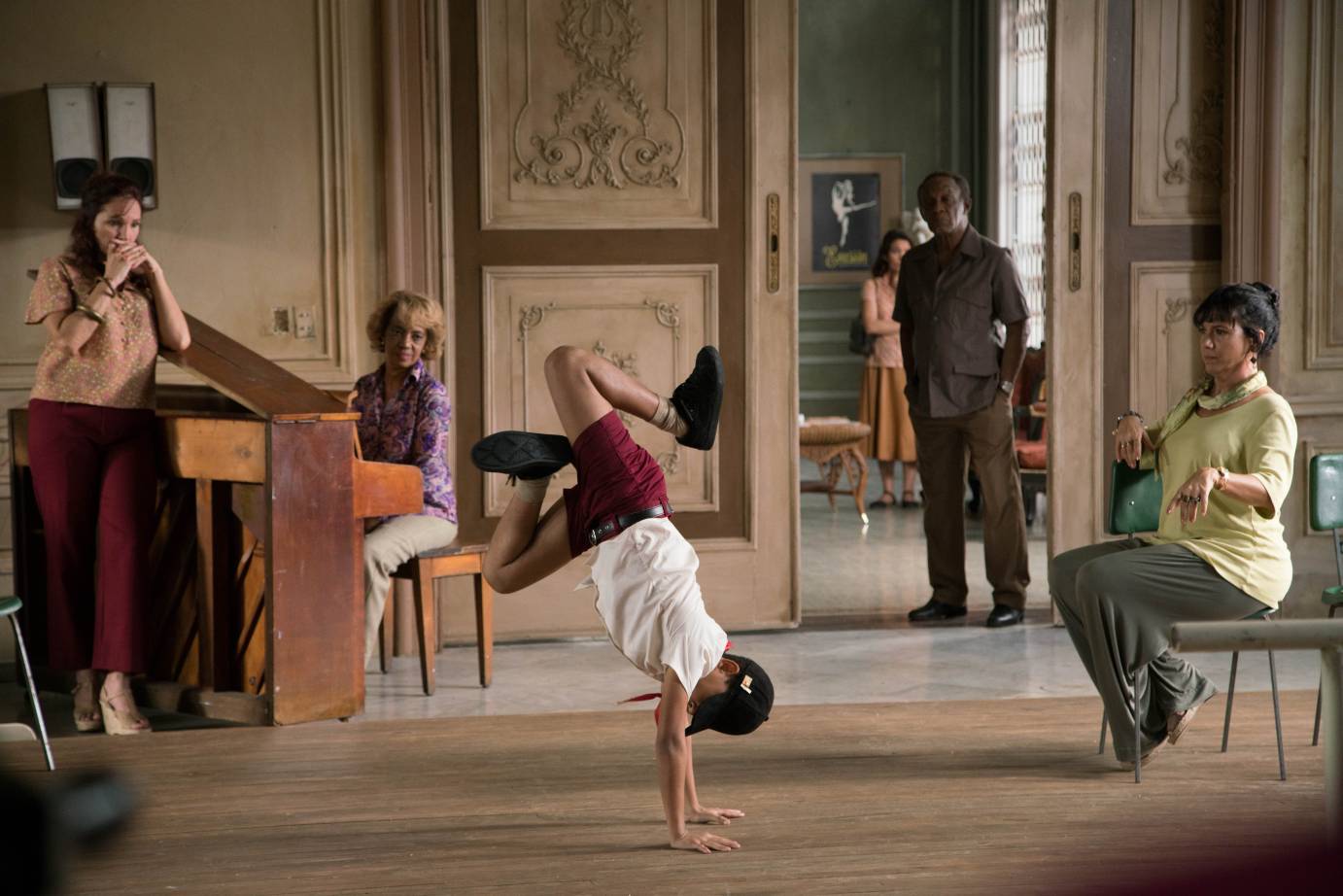 Carlos Acosta breakdancing in front of people in the movie version of his life